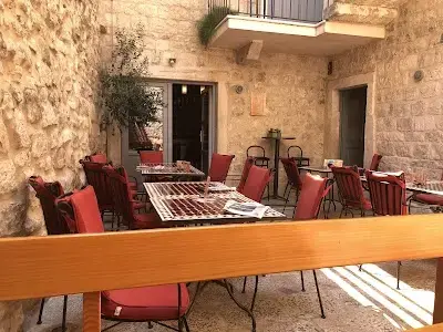 Stone-walled outdoor terrace at Bedem restaurant